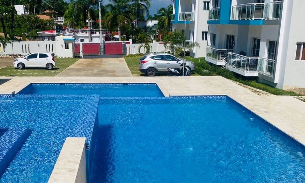 Urbanizacion Tavarez Apartment | Elegant 2BR/2BA condo: unwind by the pool. Guest-friendly, near all