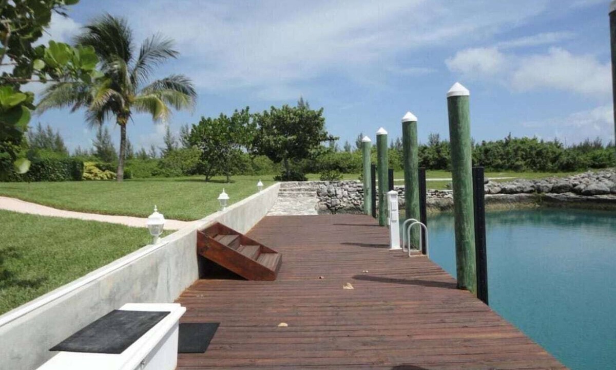 West End House | Green House With Dock in West End Bahamas Old Bahama Day