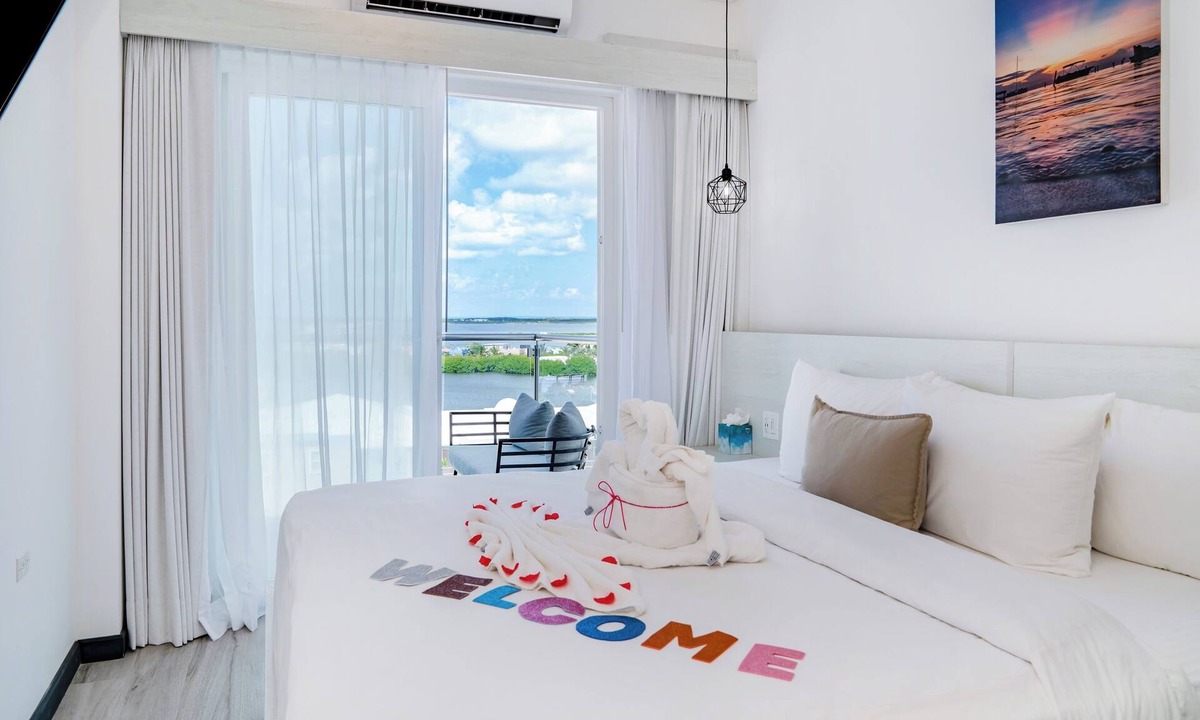 San Pedro Hotel | Sunset Unit 515 Lagoon-View | Balcony | Watermark