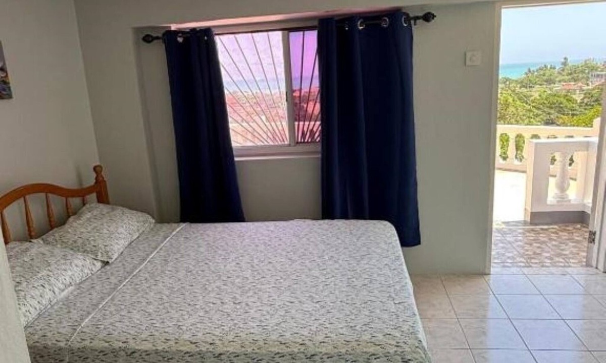 Treasure Beach House | Superstar Living - Room#01 with AC : Double bed with Balcony & sea view