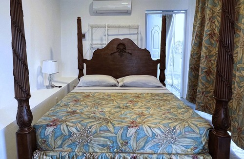 Cabrera Hotel | A suite with ocean view balconies, walk-in shower, pool, fire pit, & more!