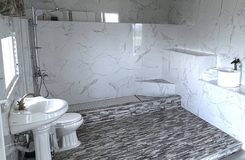 Cabrera Hotel | A suite with ocean view balconies, walk-in shower, pool, fire pit, & more!