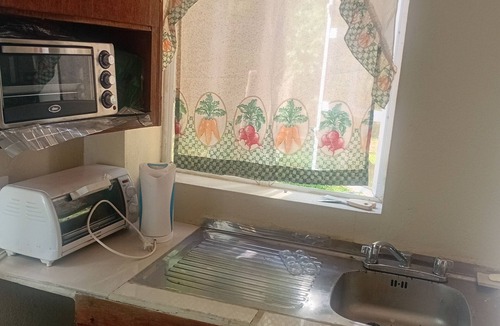 Marigot Bay Apartment | Beautiful 1-bedroom apartment with AC. Beach five minute walk. Pool access.