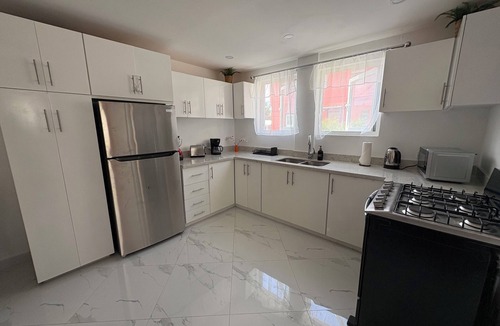 Bois d'Orange Apartment | Beautiful Modern Coral Apartment near the beach, w/rooftop terrace for relaxing.