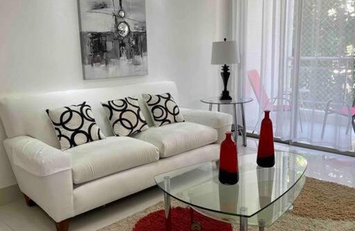 Ensanche Naco Apartment | Bright 1BR Apt, Private Parking, AC, Wifi, Balcony
