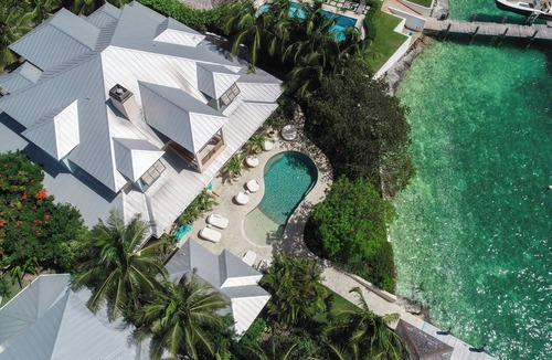 Dunmore Town House | Buttonwood – Luxury Villa on Bay, Private Dock, Oceanside Furniture, Pickleball