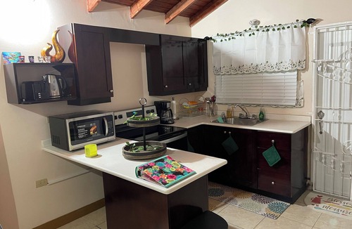 Old Harbour House | Charming gated 2-bedroom house with WiFi, AC, and spacious yard
