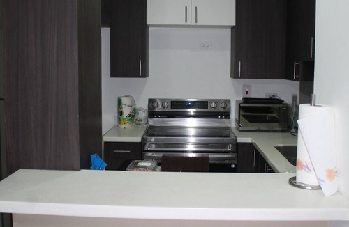 Eden Gardens Apartment | Charming Serene 2-bedroom apartment @The Bromptons New Kingston w/pool & gym