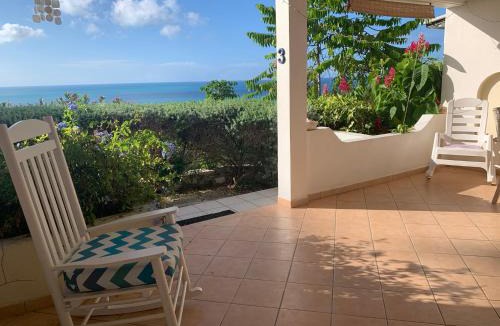 Dickenson Bay Apartment | Cozy sea view apartment with beach at walking distance and pool