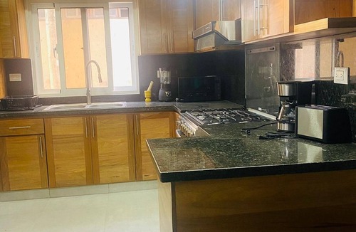 Urbanizacion Tavarez Apartment | Elegant 2BR/2BA condo: unwind by the pool. Guest-friendly, near all