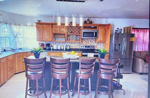 Tower Isle House | Elegant Estate Home Ocean/view . balconies Garden/pool view lush greenery