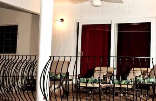 Tower Isle House | Elegant Estate Home Ocean/view . balconies Garden/pool view lush greenery