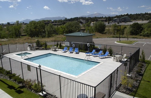 Rockrimmon Condo | Equipped Suite with Mountain View | Outdoor Pool Access, Housekeeping + Business Center