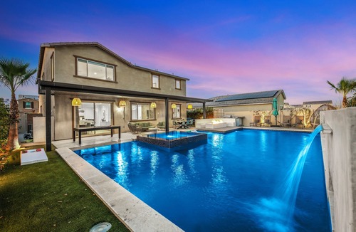 Coachella House | Escape to this newly remodeled 7-bedroom desert retreat designed for relaxation and fun. Enjoy a large resort-style pool and spa, a fully stocked kitchen, spacious game room, and outdoor games perfect for group play under endless blue skies. Whether
