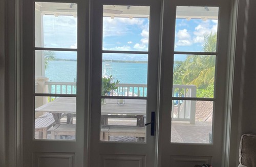 Dunmore Town House | Exquisite Bay front Estate, dockage 100' boat, LG pool, close to town and beach.