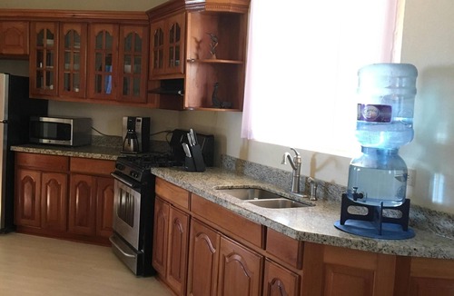 Hopkins House | Luxury, Beachfront, Home with Resort-amenities, Housekeeping & FREE GOLF CART.