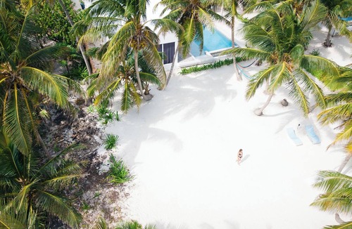 San Pedro House | Luxury beachfront vacation rental on Ambergris Caye with a private pool, rooftop lounge, private casita, direct beach access, and full-service concierge. Perfect for families, couples, and group getaways in Belize.