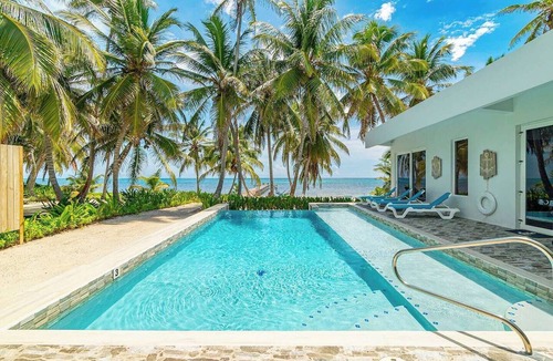 San Pedro House | Luxury beachfront vacation rental on Ambergris Caye with a private pool, rooftop lounge, private casita, direct beach access, and full-service concierge. Perfect for families, couples, and group getaways in Belize.