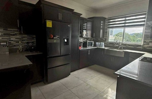 Saint Andrew Apartment | Maison Blanc et Noir|A luxury Kingston 8 apartment with a cinematic rooftop pool