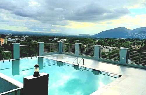 Saint Andrew Apartment | Maison Blanc et Noir|A luxury Kingston 8 apartment with a cinematic rooftop pool