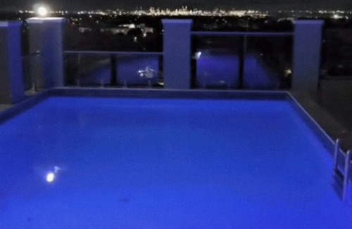 Saint Andrew Apartment | Maison Blanc et Noir|A luxury Kingston 8 apartment with a cinematic rooftop pool