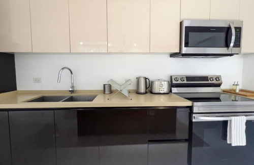 Saint Andrew Apartment | Modern 2BR Condo | Pool | Prime Kingston 6