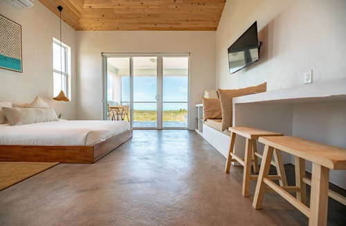 Long Bay Apartment | Modern Studio with Expansive Ocean View, Pool