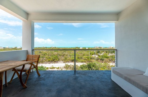 Long Bay Apartment | Modern Studio with Expansive Ocean View, Pool