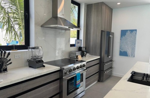 Blue Hills Villa | New BEACHFRONT Aqua Blu Villa-4 King Bdrm/6 Bath-Oceanfront bliss-up to 8 guests
