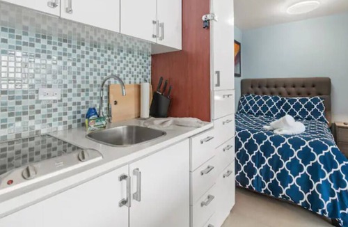 San Juan Apartment | NEW! Modern Beachfront Studio steps from water!