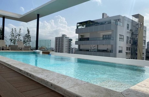 Evaristo Morales Condo | New-Pool-Comfy-CityCenter-WiFi-AC-Safe-YellowKey