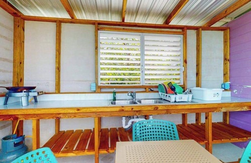 Sittee Point Apartment | Overwater cabin with oceanfront deck, island kitchen & sea breeze views