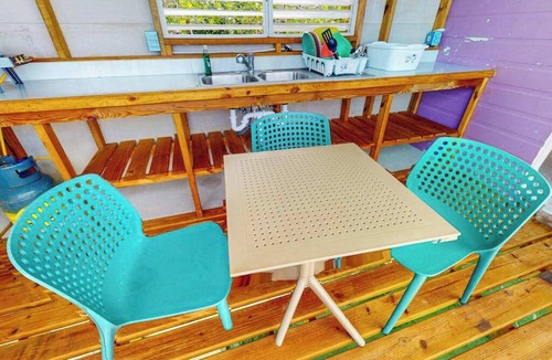 Sittee Point Apartment | Overwater cabin with oceanfront deck, island kitchen & sea breeze views
