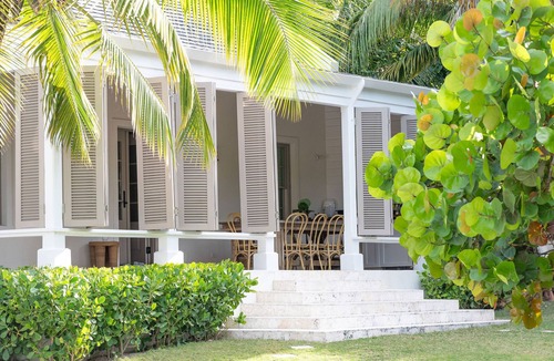 Dunmore Town House | Private home steps from the pink sand of Harbour Island w pool and guest cottage