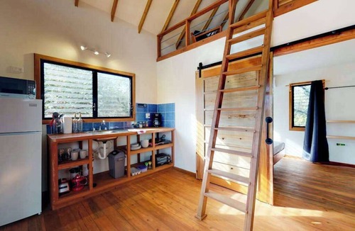 Surfside Cabin | Quiet treehouse cabana with veranda, hammock, WiFi & partial AC - walk to beach