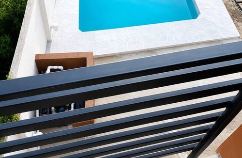 Hellshire Apartment | Relax in Style Modern Apartment with Balcony Overlooking the Pool