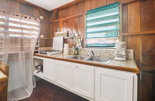 Placencia Cabin | Renovated Cabana Near the Beach with Screened Porch, Hammock, & Free WiFi