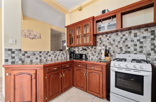 Morne Rouge Apartment | Roomy [1,001 sq ft] two bedroom Unit, steps away from white sand beach.