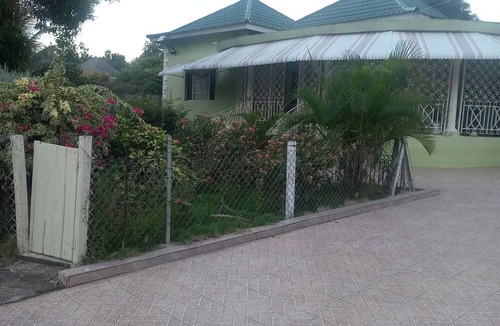 IronShore Estates House | Tranquil haven. Lovely and spacious two bedroom bungalow very large sitting room