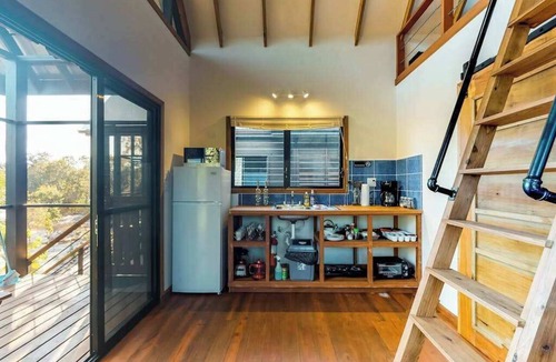 Surfside Apartment | Treehouse cabana suite in a quiet area with veranda, WiFi & partial AC - walk to beach