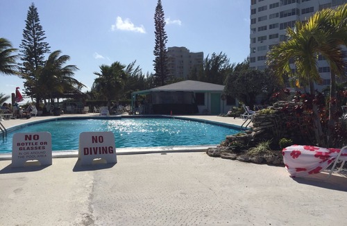 Discovery Bay Condo | Tropical paradise steps away from gorgeous sandy beach & beautiful blue water