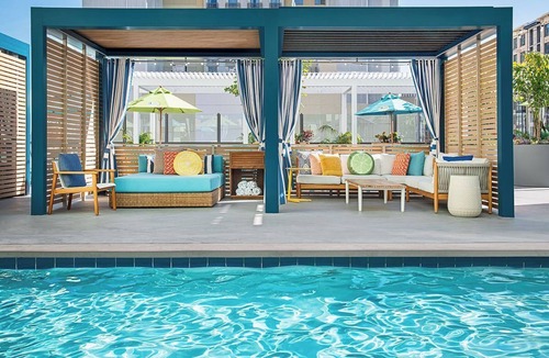 East Village Hotel | Unwind in a Tropical-Themed Room with Festive Vibes