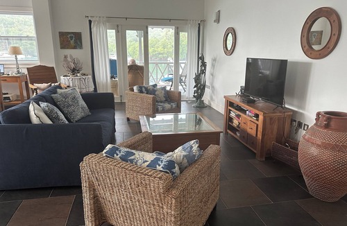 Marigot Bay Apartment | Waterfront apartment with large balcony, stunning views of bay and use of pools