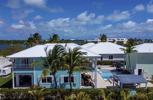 Treasure Cay House | WATERFRONT FAMILY COMPOUND 3 HOMES SLEEPS 30 WITH POOL, 3 BOAT SLIPS