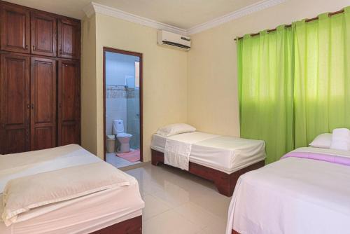 1-Bedroom Apartment with 3 Beds Private Balcony Near SDQ Airport Fast Wi-F