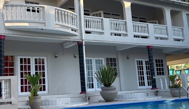 Aparthotel 5-minutes away from beach w/AC, Wi-Fi, & pool view in RodneyBay