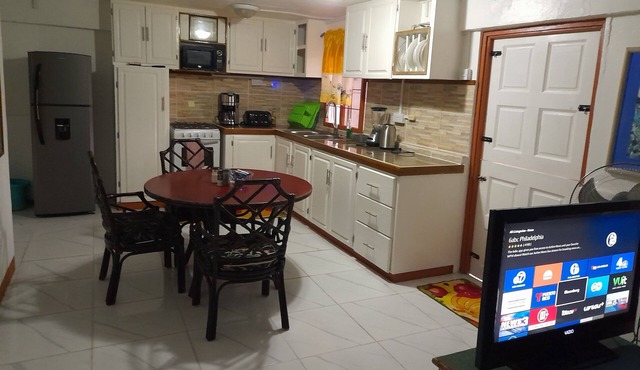 Caribbean house 3 mins walk to the marina and port.