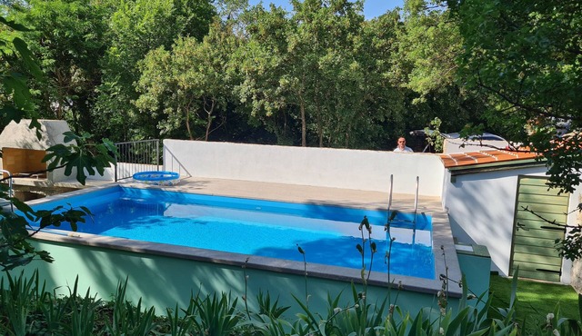 Kids friendly house with large private, fenced garden, pool, 1km beach in Omišalj