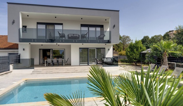 New villa with pool near a beach in Pinezići