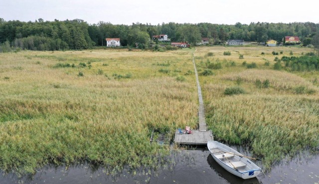 Seaside plot with private jetty, rowing boat & sunset in Kvicksund